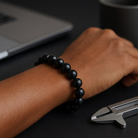 Lifestyle wrist shot of Black Tourmaline 8mm bracelet showing fit and shine