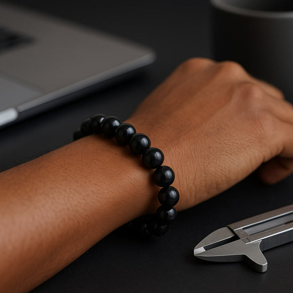 Lifestyle wrist shot of Black Tourmaline 8mm bracelet showing fit and shine