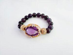 A beaded bracelet with amethyst crystal showcasing Crystal Bracelet Benefits